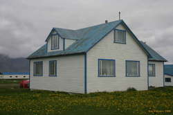 Farmhouse amidst spring flowers, Furubrekka?