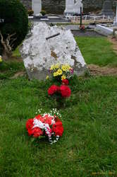 Old, unmaintained headstone, but it still gets flowers