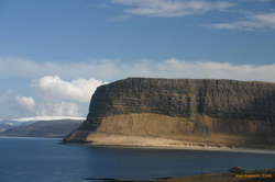 Big cliffs towering over the road