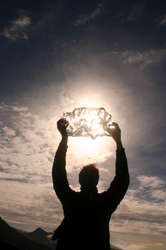 Karl holds aloft the treasured chunk of ice