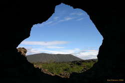 Hverfjall through an arch at Dimmuborgir