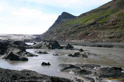 We need to cross this river. We ended up having to go right up to the head of the river and climb up onto the hillside on the right