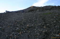 Coming back down some scree slopes towards the sand, and glory