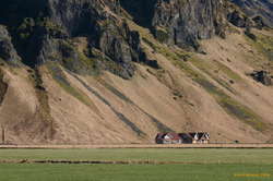 Farmhouse under the mountains