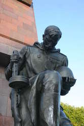 Mustachioed soldiers guard the entrance