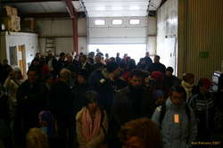 The whole town in a fish shed for some music