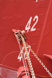 Work pulleys bolted to the side of the ship