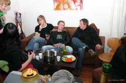 Guests around a punchbowl.