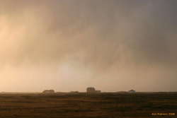 Houses under sunset and rain, near grindavík