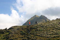 Volunteer track workers underneath Rjupnafell