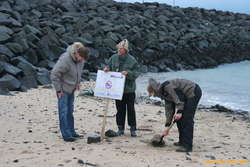 Eggert, Bjöggi and Karl moving the sign in from the tide again