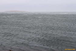 Wind ripping apart waves