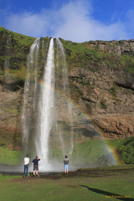 Logi asks what the rainbow means, at Seljalandsfoss