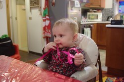Stella helping wrap presents